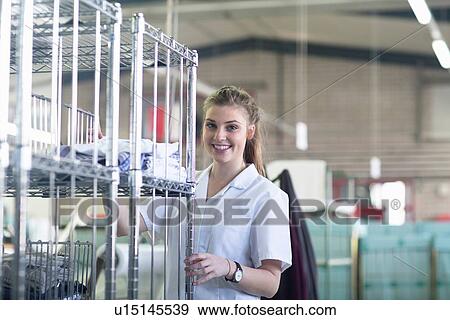 Stock Photo - Woman working in laundry. Fotosearch