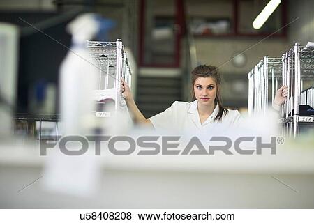 Stock Photo - Woman working in laundry. Fotosearch