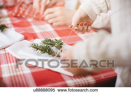 Stock Photography - Women preparing for family Christmas party. Fotosearch