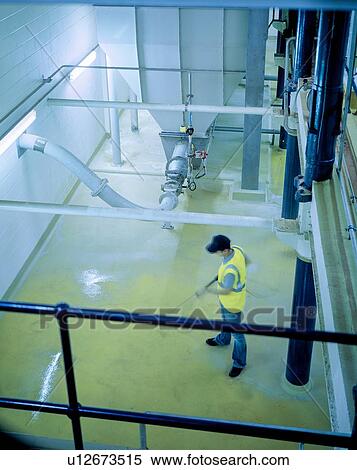 "Worker cleaning floor and equipment in brewery, high angle view" View Large Photo Image Stock Photography - "Worker cleaning floor and equipment in brewery, high angle view". Fotosearch