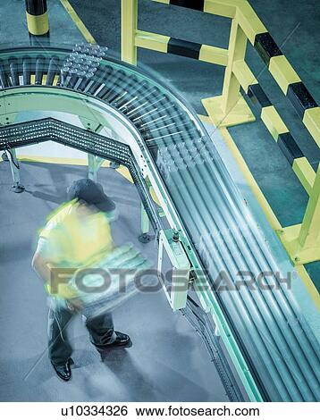 "Worker stacking cans of beer in brewery, high angle view" View Large Photo Image Stock Photograph - "Worker stacking cans of beer in brewery, high angle view". Fotosearch