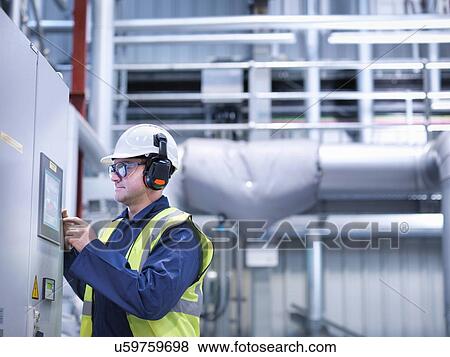 Worker using touch screen controls in gas fired power station View Large Photo Image Stock Photo - Worker using touch screen controls in gas fired power station. Fotosearch