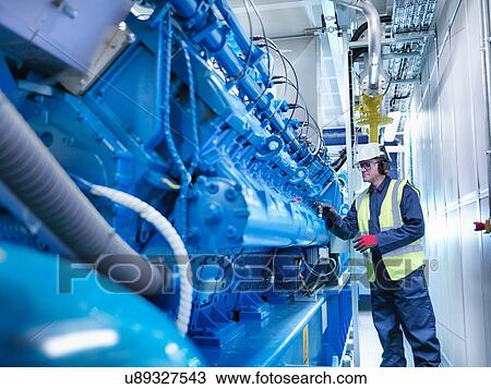 Worker with gas fired generator in gas fired power station View Large Photo Image Stock Image - Worker with gas fired generator in gas fired power station. Fotosearch