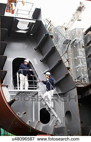 Stock Photo - "Workers at shipyard, GoSeong-gun, South Korea". Fotosearch