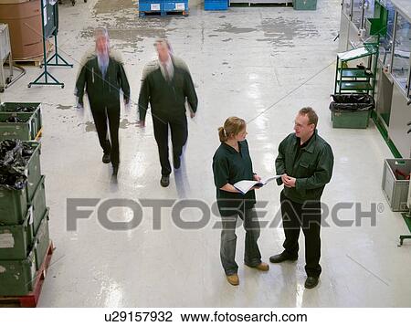 "Workers in discussion on factory floor, high angle view" View Large Photo Image Stock Image - "Workers in discussion on factory floor, high angle view". Fotosearch