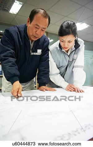 "Workers looking at plans of ship, GoSeong-gun, South Korea" View Large Photo Image Stock Image - "Workers looking at plans of ship, GoSeong-gun, South Korea". Fotosearch