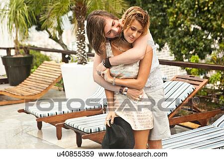 "Young couple hugging at hotel poolside, Rio De Janeiro, Brazil" View Large Photo Image Stock Photo - "Young couple hugging at hotel poolside, Rio De Janeiro, Brazil". Fotosearch