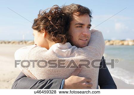 "Young couple hugging each other on beach, Tel Aviv, Israel" View Large Photo Image Stock Photo - "Young couple hugging each other on beach, Tel Aviv, Israel". Fotosearch