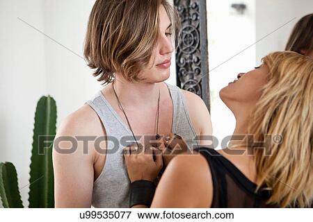 Young couple in hotel lobby View Large Photo Image Stock Photo - Young couple in hotel lobby. Fotosearch