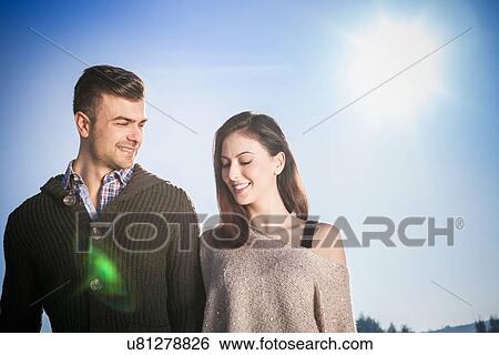 Young couple in sunlight View Large Photo Image Stock Photograph - Young couple in sunlight. Fotosearch