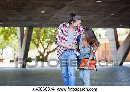Picture - Young couple laughing. Fotosearch