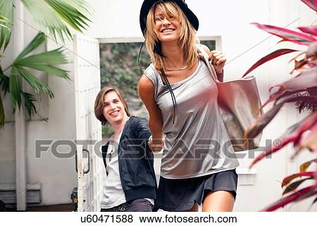 "Young couple leaving hotel, Rio De Janeiro, Brazil" View Large Photo Image Stock Photo - "Young couple leaving hotel, Rio De Janeiro, Brazil". Fotosearch