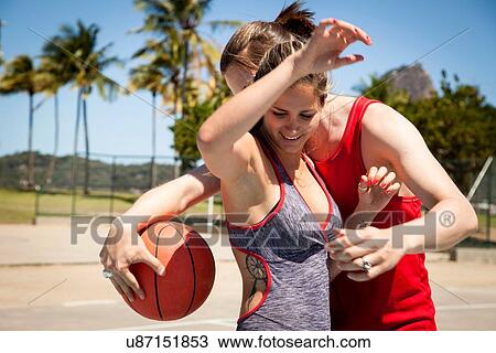 "Young couple on basketball court in front of Sugarloaf mountain, Rio De Janeiro, Brazil" View Large Photo Image Stock Image - "Young couple on basketball court in front of Sugarloaf mountain, Rio De Janeiro, Brazil". Fotosearch