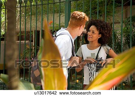 Stock Image - Young couple talking. Fotosearch