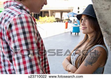 Stock Image - Young couple talking. Fotosearch