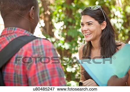 Stock Photo - Young couple talking. Fotosearch
