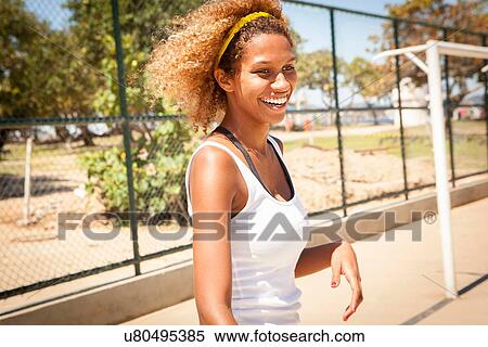 Young female basketball player on court View Large Photo Image Stock Photography - Young female basketball player on court. Fotosearch