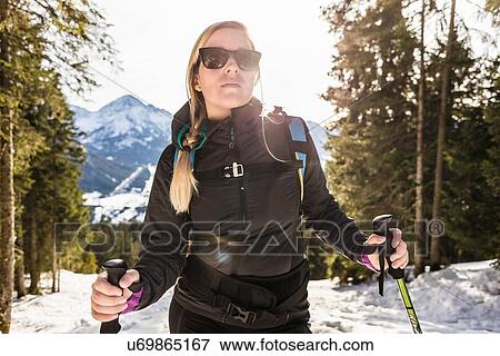 "Young female hiker in snow covered forest, Reutte, Tyrol, Austria" View Large Photo Image Stock Photo - "Young female hiker in snow covered forest, Reutte, Tyrol, Austria". Fotosearch