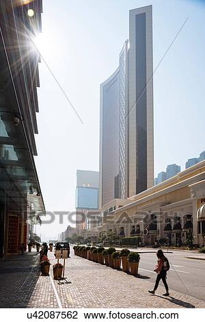 "Young female tourist strolling on city street, Macau, Hong Kong, China" View Large Photo Image Stock Image - "Young female tourist strolling on city street, Macau, Hong Kong, China". Fotosearch