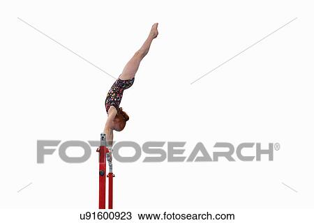 Young gymnast performing on uneven bars View Large Photo Image Stock Image - Young gymnast performing on uneven bars. Fotosearch