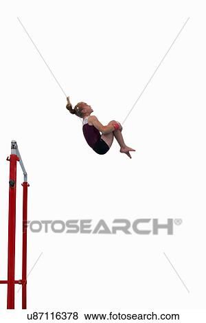 Young gymnast performing on uneven bars View Large Photo Image Stock Photo - Young gymnast performing on uneven bars. Fotosearch