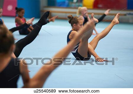 Young gymnasts practising moves View Large Photo Image Stock Photo - Young gymnasts practising moves. Fotosearch