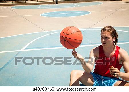 Young male basketball player spinning ball on finger View Large Photo Image Stock Image - Young male basketball player spinning ball on finger. Fotosearch