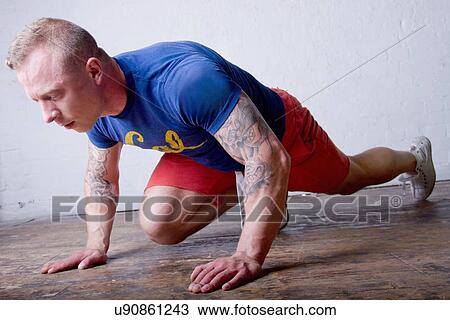 Young man exercising View Large Photo Image Stock Image - Young man exercising. Fotosearch
