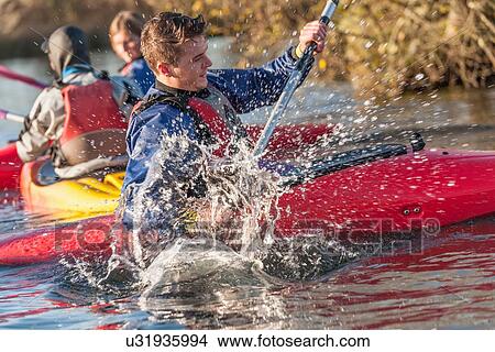 Young man kayaking View Large Photo Image Picture - Young man kayaking. Fotosearch