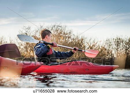 Young man kayaking View Large Photo Image Stock Photo - Young man kayaking. Fotosearch
