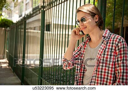 Stock Photography - Young man on cell phone. Fotosearch