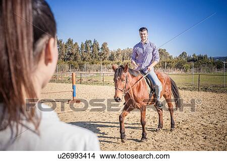 Picture - Young man riding horse. Fotosearch