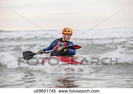 Young man sea kayaking View Large Photo Image Stock Photography - Young man sea kayaking. Fotosearch