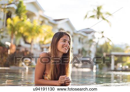 Stock Image - "Young woman at swimming pool, Panay Island, Visayas, Philippines". Fotosearch
