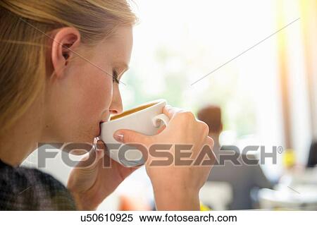 "Young woman drinking coffee in cafe, close-up" View Large Photo Image Stock Photography - "Young woman drinking coffee in cafe, close-up". Fotosearch
