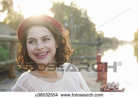 Young woman enjoying park View Large Photo Image Picture - Young woman enjoying park. Fotosearch