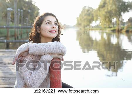 Young woman enjoying park View Large Photo Image Stock Image - Young woman enjoying park. Fotosearch