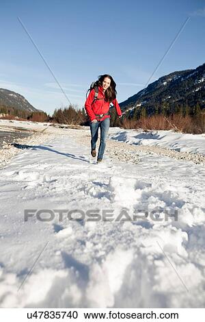"Young woman hiking in snow, Alps, Germany" View Large Photo Image Stock Image - "Young woman hiking in snow, Alps, Germany". Fotosearch