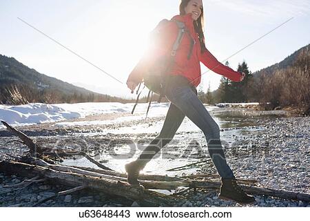 Stock Image - "Young woman hiking in the Alps, Germany". Fotosearch