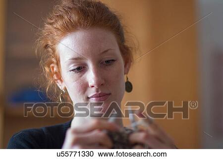 Young woman knitting View Large Photo Image Stock Image - Young woman knitting. Fotosearch