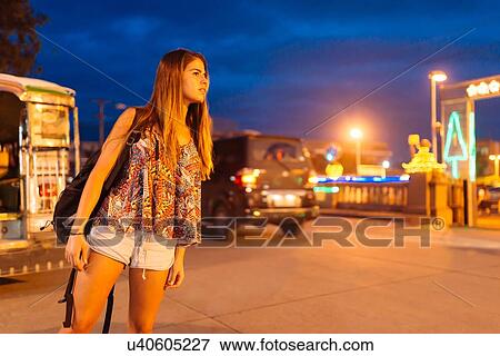 "Young woman looking out from street at night, Tagbilaran, Bohol Province, Philippines" View Large Photo Image Stock Photo - "Young woman looking out from street at night, Tagbilaran, Bohol Province, Philippines". Fotosearch