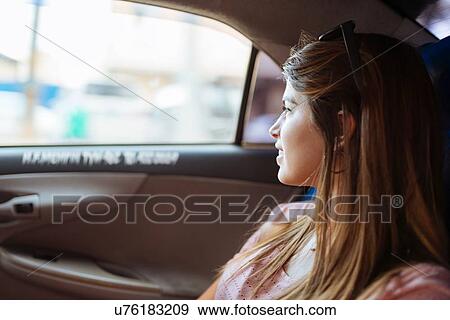 "Young woman looking out of taxi window, Manila, Philippines" View Large Photo Image Stock Photo - "Young woman looking out of taxi window, Manila, Philippines". Fotosearch