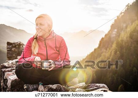 Stock Image - "Young woman on top of Ehrenberg castle ruins, Reutte, Tyrol, Austria". Fotosearch