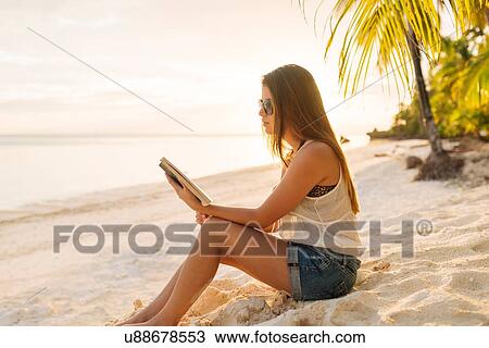 "Young woman reading book on Anda beach, Bohol Province, Philippines" View Large Photo Image Stock Image - "Young woman reading book on Anda beach, Bohol Province, Philippines". Fotosearch