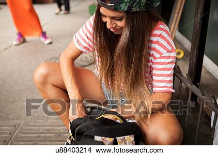 "Young woman searching her rucksack on street, Copacabana town, Rio De Janeiro, Brazil" View Large Photo Image Picture - "Young woman searching her rucksack on street, Copacabana town, Rio De Janeiro, Brazil". Fotosearch