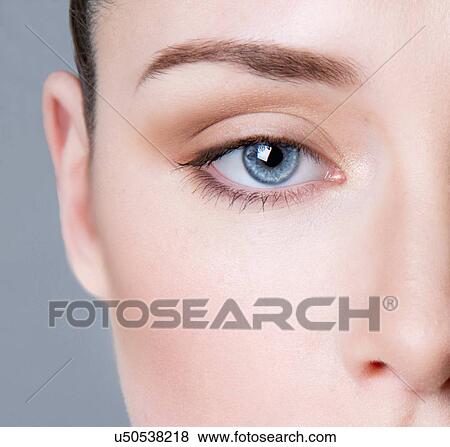 "Young woman wearing eye make-up, close-up" View Large Photo Image Stock Photo - "Young woman wearing eye make-up, close-up". Fotosearch