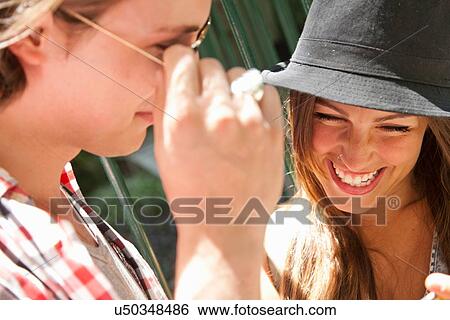 "Young woman wearing hat, laughing" View Large Photo Image Stock Photograph - "Young woman wearing hat, laughing". Fotosearch