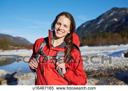 Stock Photography - "Young woman wearing red jacket, portrait". Fotosearch
