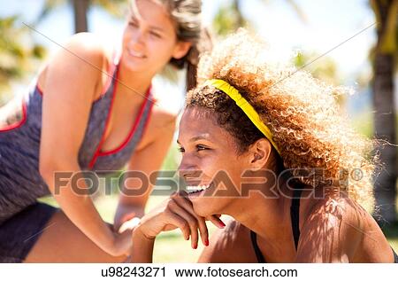 "Young woman with curly hair smiling, portrait" View Large Photo Image Stock Image - "Young woman with curly hair smiling, portrait". Fotosearch