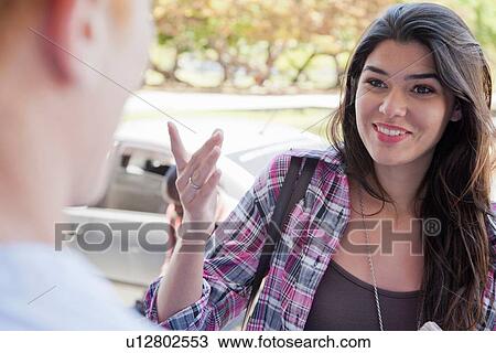 "Young woman with long brown hair, smiling" View Large Photo Image Stock Image - "Young woman with long brown hair, smiling". Fotosearch